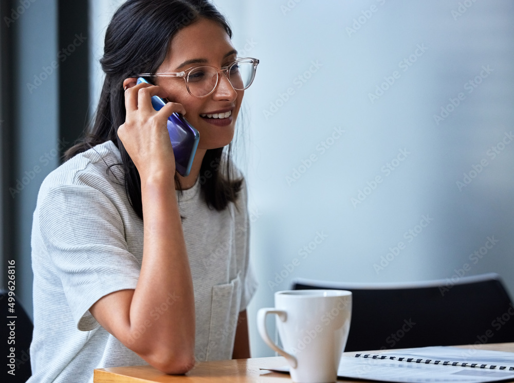 Unable to connect with negativity and toxic people today. Shot of a young woman having coffee and working in a modern office. Unable to connect with negativity and toxic people today. Shot of a young woman having coffee and working in a modern office.