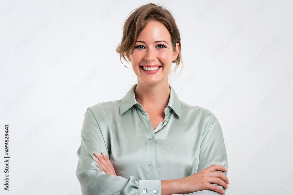 Smiling and attractive woman studio portrait while standing at isolated white background Smiling and attractive woman studio portrait while standing at isolated white background