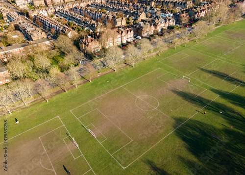 Aerial view of football field and houses in suburban south London area  photo