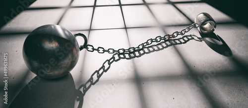 Prison ball and chain, open shackle on dungeon floor close up. Incarceration and escape. 3d render photo