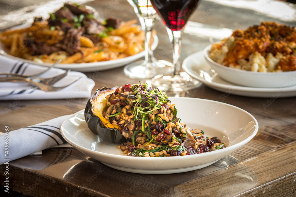 Roasted Acorn Squash on a Wooden Table Roasted Acorn Squash on a Wooden Table