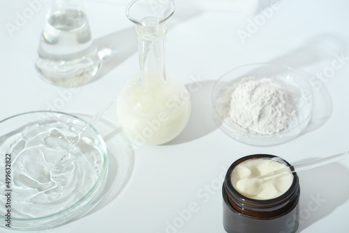 laboratory dishes and glassware on a lab table. fermentation, fermented beauty skin care. cream or serum for anti age treatment, powder cosmetic ingredient.