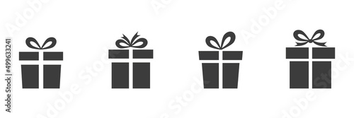 Gift boxes icons set. Black presents with bows collection. Surprise silhouette. Vector isolated on white. photo