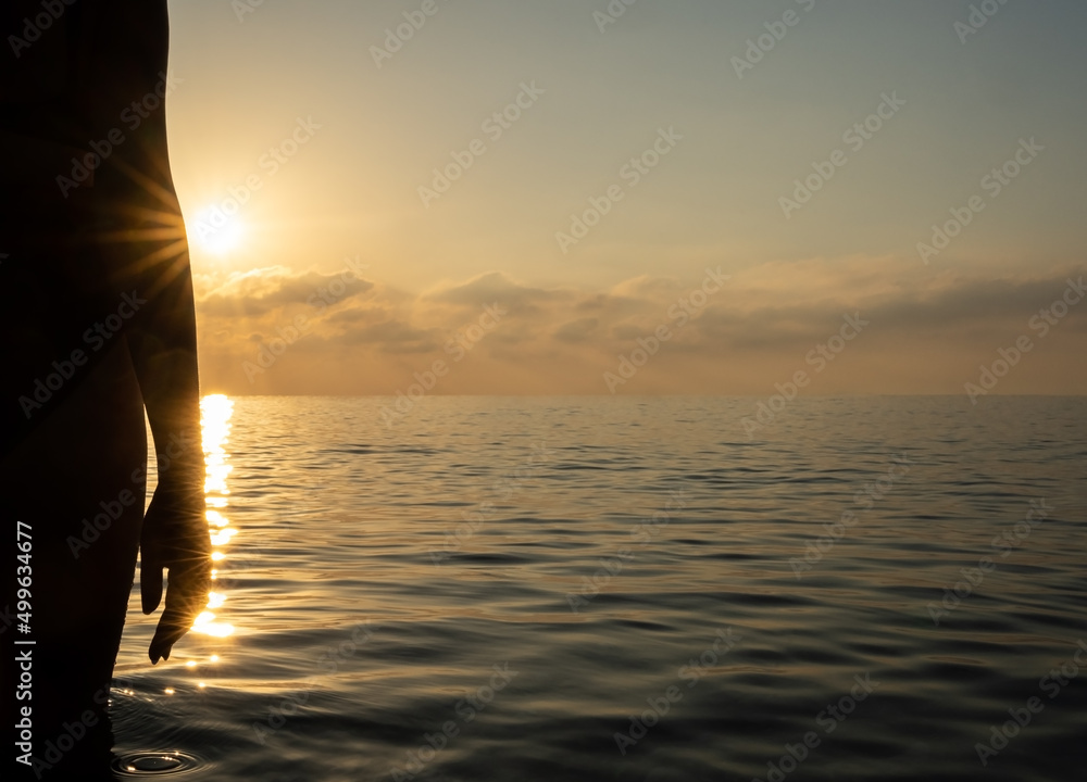 Fototapeta premium The girl stands on the seashore