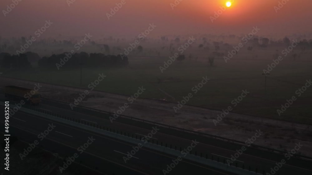 Aerial Over Morning Mist Over Punjab Rural Landscape With Orange Sunrise In Sky Aerial Over Morning Mist Over Punjab Rural Landscape With Orange Sunrise In Sky