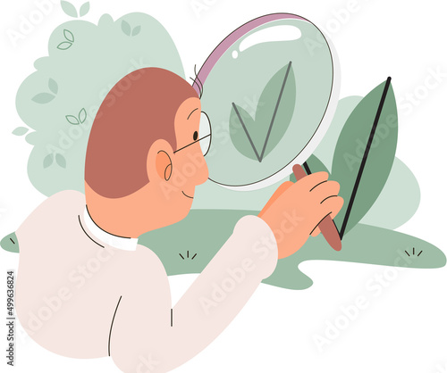 Male scientist, botanist studies and analyzes plant examining leaf through magnifying glass. Cultivation and processing of plant. Laboratory worker ecologist studying vegetable life outdoors