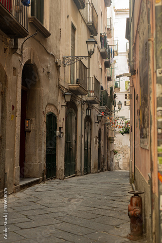 Ancient streets of the southern sea city. Lovely houses with shutters. Tourism in old Europe - Salerno  Southern Italy.