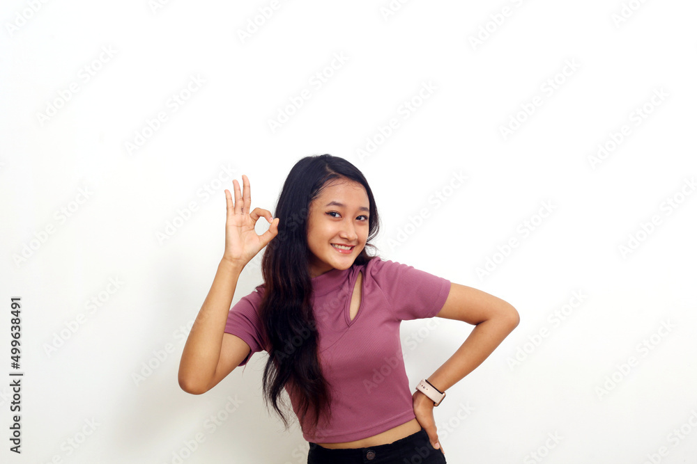 Young asian girl feeling proud, carefree, confident and happy, smiling positively with okay gesture Young asian girl feeling proud, carefree, confident and happy, smiling positively with okay gesture