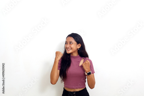 asian girl showing yeah gesture isolated on white background