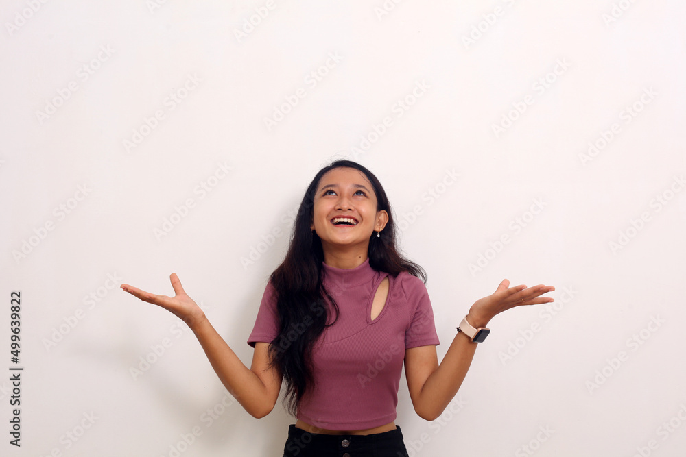 Portrait of beautiful woman over isolated background being amazed and surprised looking and hands up Portrait of beautiful woman over isolated background being amazed and surprised looking and hands up