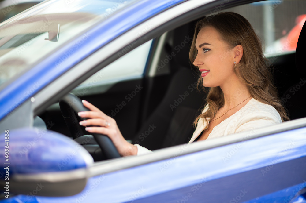 Young lady driving her car