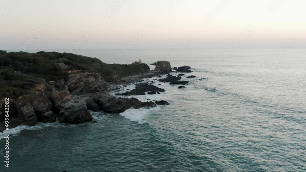 Rugged Cliffs And Ocean Waves At Puerto Escondido, Oaxaca, Mexico - aerial drone shot Rugged Cliffs And Ocean Waves At Puerto Escondido, Oaxaca, Mexico - aerial drone shot