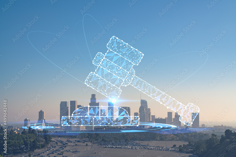 Skyline panorama of Los Angeles downtown at sunset, California, USA. Skyscrapers of LA city. Glowing hologram of legal icons. The concept of law, order, regulations and digital justice.