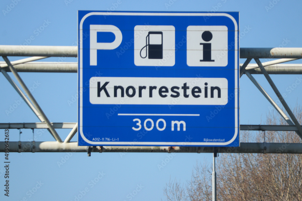 Blue direction and information sign for the directions on Motorway A12 heading junction to Petrol station and parking lot Knorrestein in Zoetermeer Blue direction and information sign for the directions on Motorway A12 heading junction to Petrol station and parking lot Knorrestein in Zoetermeer