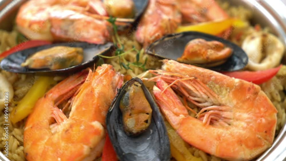 Seafood Paella with prawns, clams, mussels on saffron rice - Spanish food style Seafood Paella with prawns, clams, mussels on saffron rice - Spanish food style