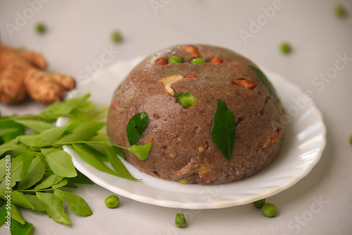 Raagi upma,multi millet upma south indian famous breakfast closeup with selective focus and blur photo