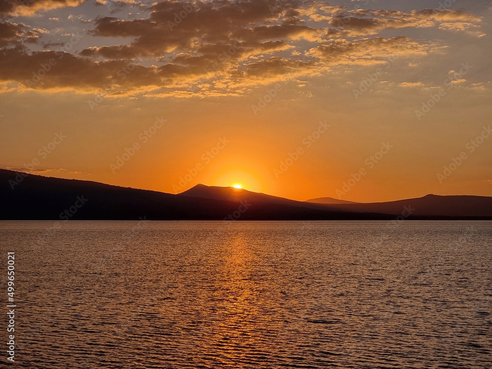 Golden sunset in the tranquility of the lake.