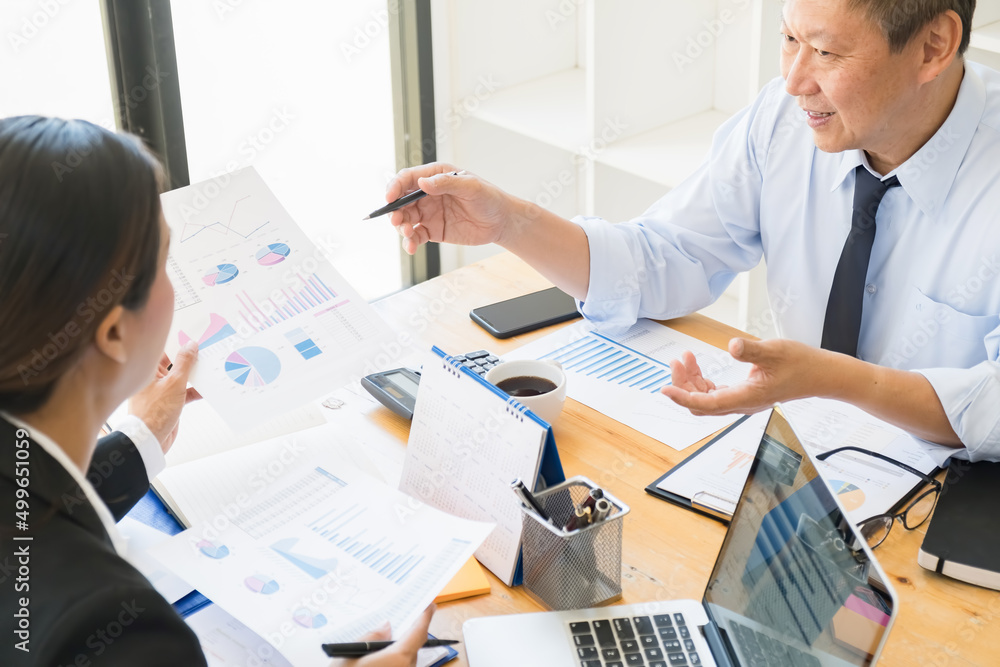 Fototapeta premium Business adviser analyzing financial figures denoting the progress Internal Revenue Service checking document. Audit concept