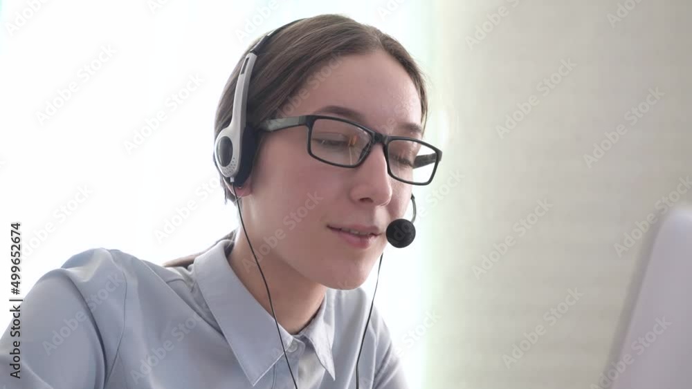 Close-up girl call center operator sells services. Call center. Close-up girl call center operator sells services. Call center.