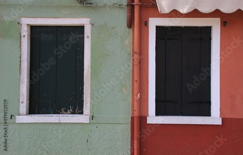 Italy, Veneto, Venezia: Detail of the contrast of colors of the houses of Burano Island.