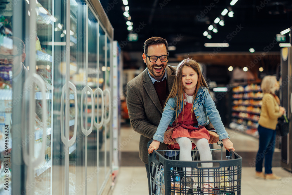 Father and daughter in a supermarket