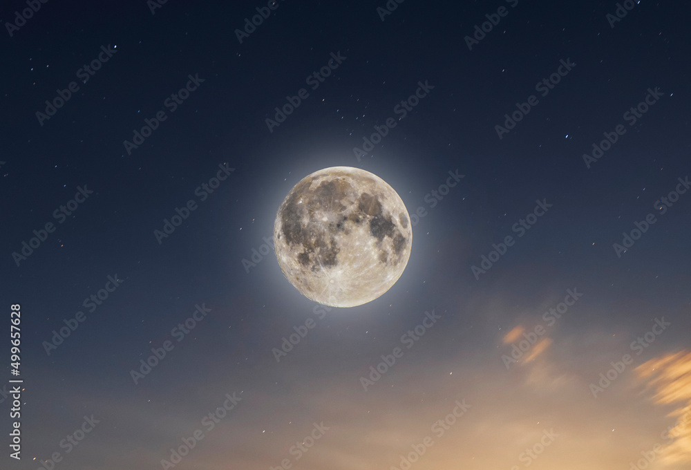 Beautiful full moon on the starry sky. Astronomical background.
