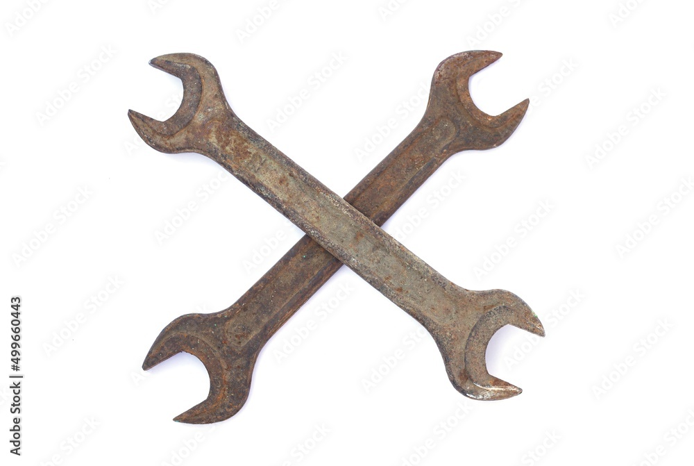 Two old rusty crossed wrenches isolated on white background Two old rusty crossed wrenches isolated on white background