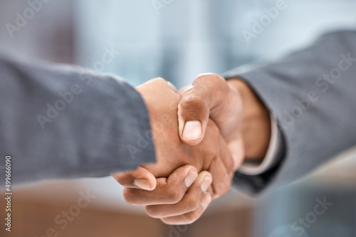 I cant say no to a good deal. Cropped shot of two businesspeople shaking hands.