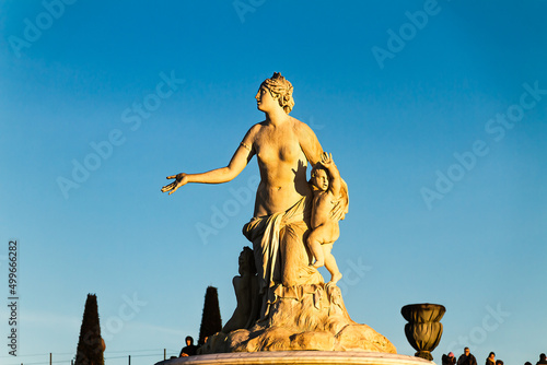 Versailles, France; View of the garden of the Palace of Versailles with orange trees, canals, statues and in front of the Latona Fountain