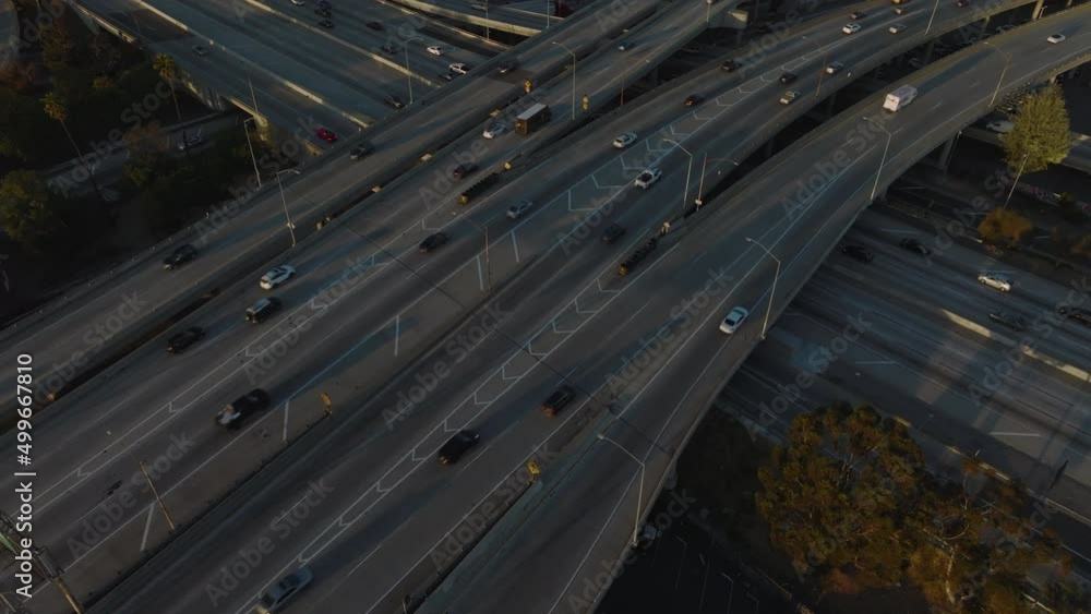 flying over crossing freeways tilting up on downtown LA skyline flying over crossing freeways tilting up on downtown LA skyline