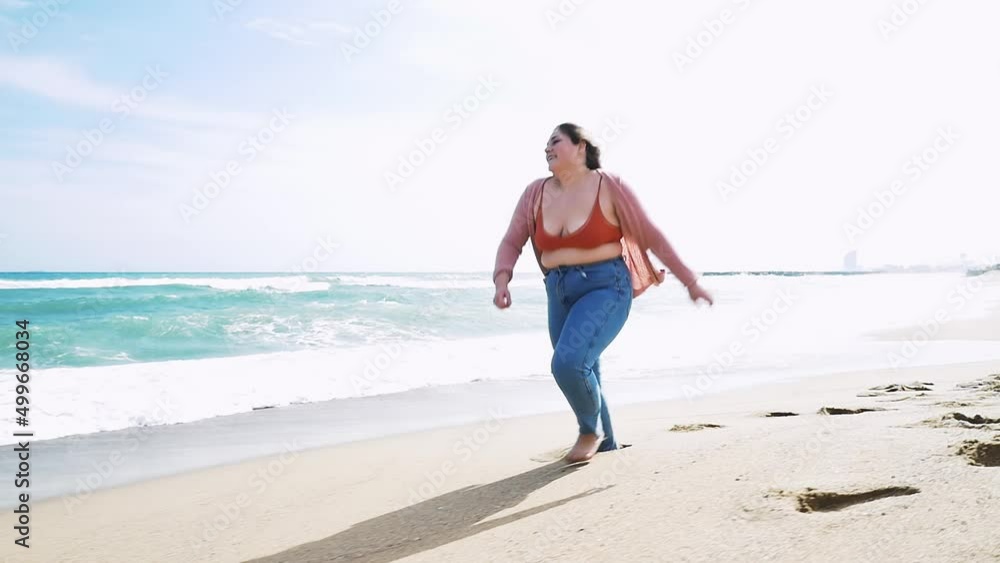 Beautiful curvy woman having fun outdoor on a beautiful day in Los Angeles, California. Body positive and self acceptance representation concepts Beautiful curvy woman having fun outdoor on a beautiful day in Los Angeles, California. Body positive and self acceptance representation concepts