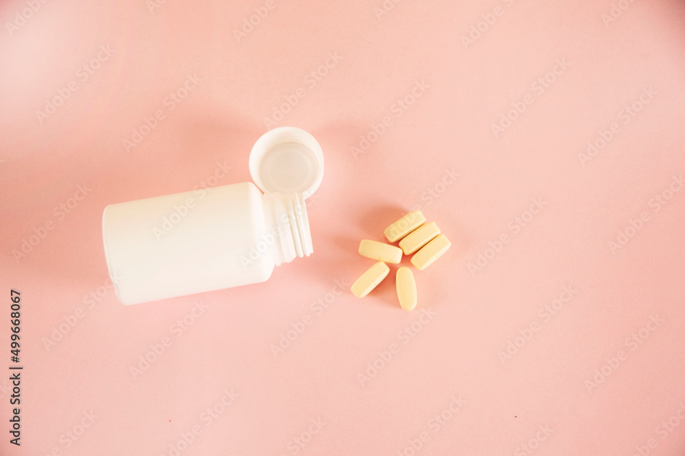 drugs and bottle on the blue table background drugs and bottle on the blue table background