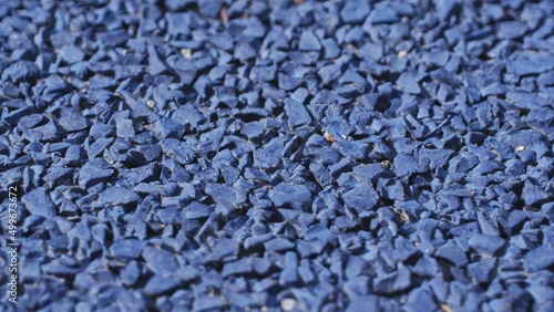 Rough Blue Shock Absorbing Synthetic Rubber Surface used as Safe Paving for Modern Playground	 photo