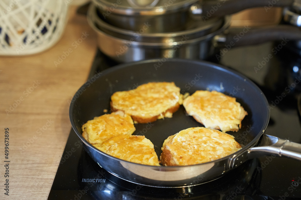 Delicious fried bread with an egg in a frying pan. Hot homemade sandwich step-by-step preparation