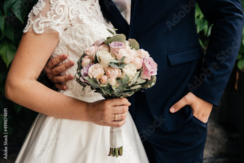 delicate bouquet in the hands of the bride close-up