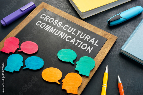 Blackboard with cross cultural communication sign on it. photo