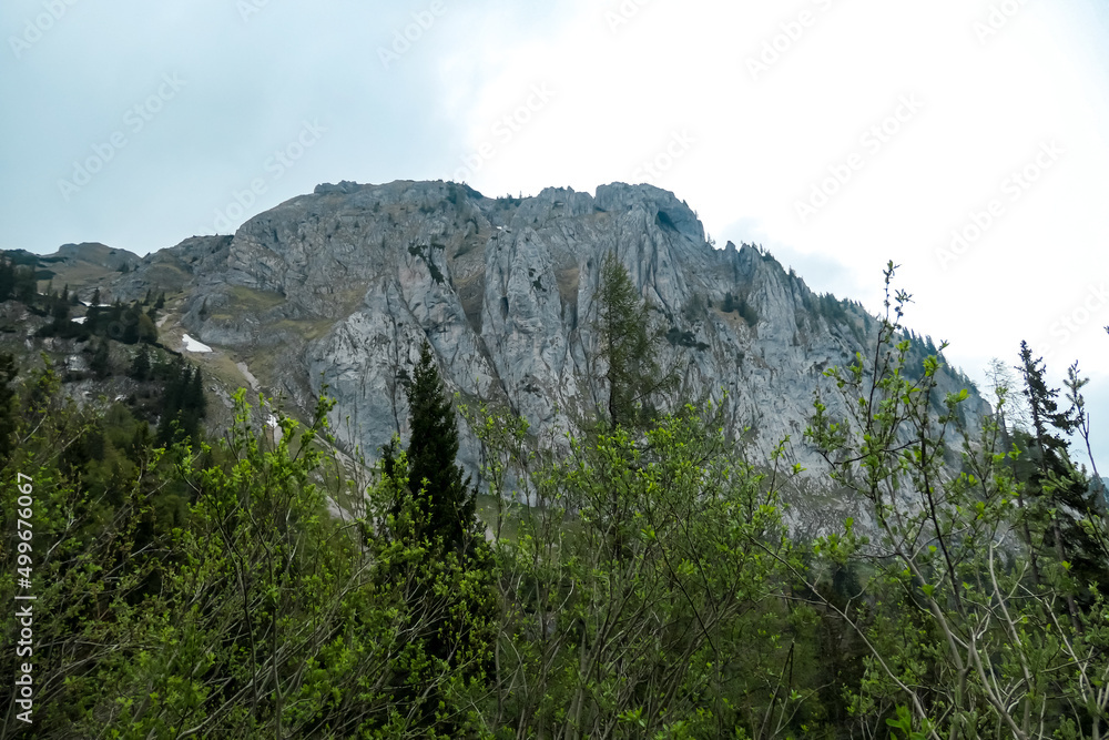 Panoramic view on the mountain peaks of the Hochschwab Region in Upper Styria, Austria. Sharp summit of Zinken in the beautiful Alps in Europe. Climbing tourism, wilderness. Concept freedom Panoramic view on the mountain peaks of the Hochschwab Region in Upper Styria, Austria. Sharp summit of Zinken in the beautiful Alps in Europe. Climbing tourism, wilderness. Concept freedom