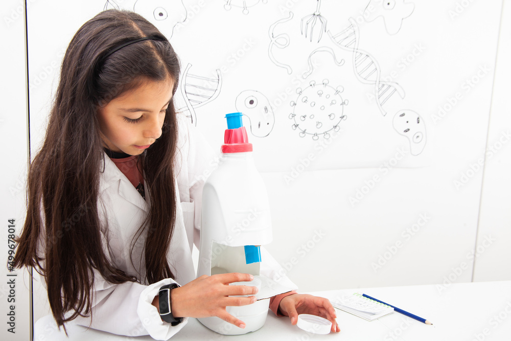 Young girl playing a life sciences professional role. Could be biologist, doctor, researcher. Dreaming about the future. Young girl playing a life sciences professional role. Could be biologist, doctor, researcher. Dreaming about the future.