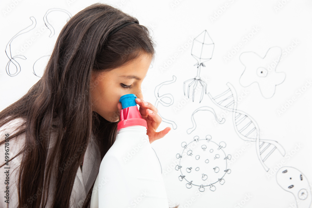 Young girl playing a life sciences professional role. Could be biologist, doctor, researcher. Dreaming about the future. Young girl playing a life sciences professional role. Could be biologist, doctor, researcher. Dreaming about the future.