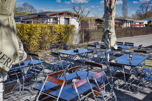 Tisch mit Sonnenschirm im Biergarten, Gartenlokal Leipzig, Sachsen photo
