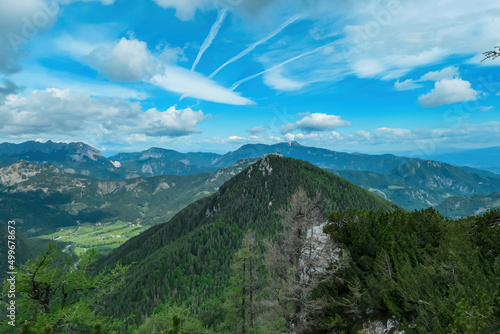 Panoramic view on mount Goli Vrh in Kamnik Savinja Alps and mountain peaks of Karawanks in Carinthia, border Austria and Slovenia. Mountaineering. Freedom wanderlust hiking concept. Bad Eisenkappel photo