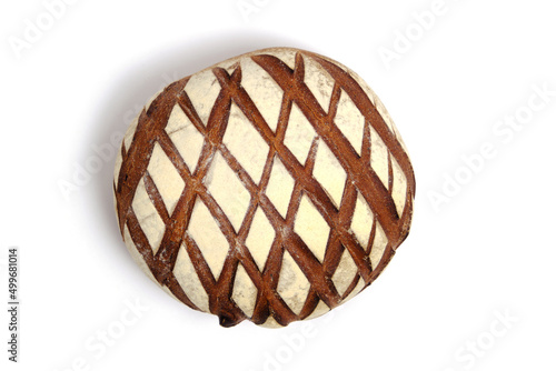 Loaf black rye bread sprinkled with flour, on a white background. © freeman83