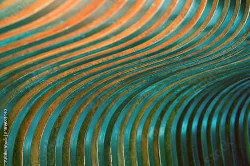 Curved wooden slats. Beautiful gradient from brown to green. Abstract background.