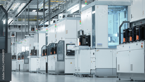 Shot of Bright Advanced Semiconductor Production Fab Cleanroom with Working Overhead Wafer Transfer System