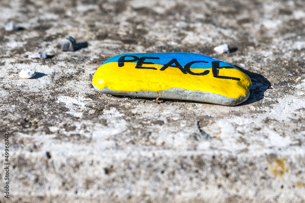 Naklejka premium peace for ukraine on a stone