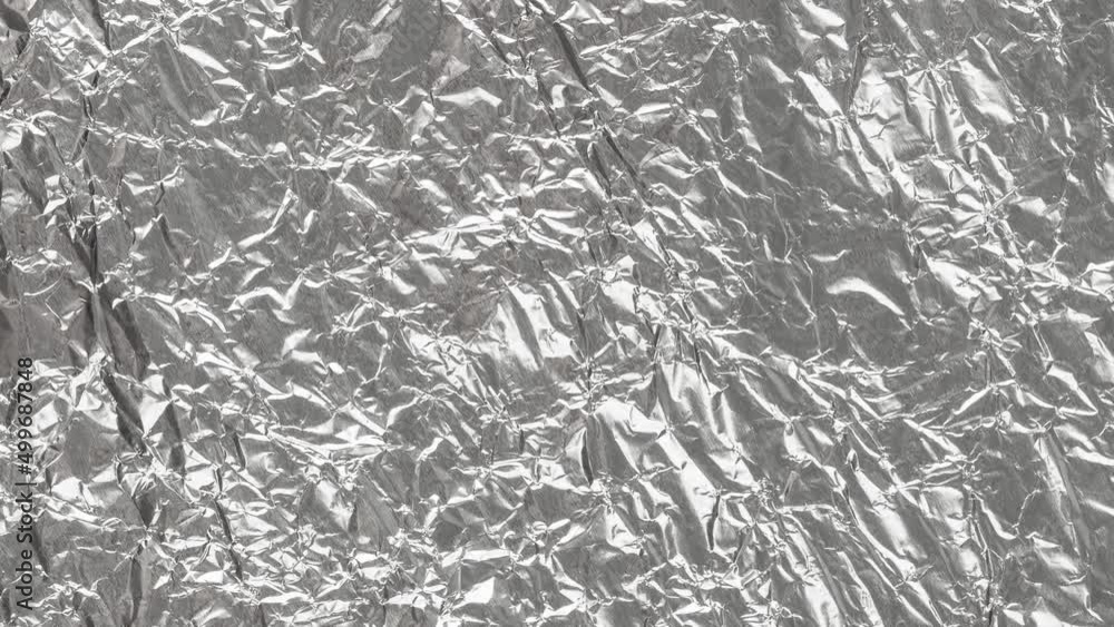 Wrinkled sheet of foil paper. Textured backdrop Wrinkled sheet of foil paper. Textured backdrop