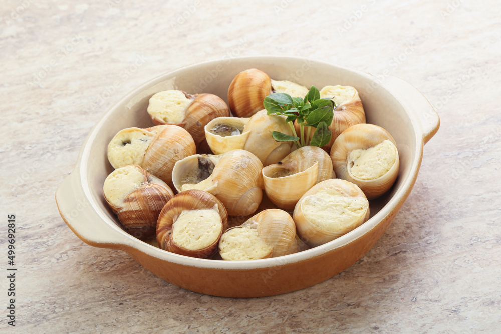 Fototapeta premium Delicous baked snail with butter - Escargot