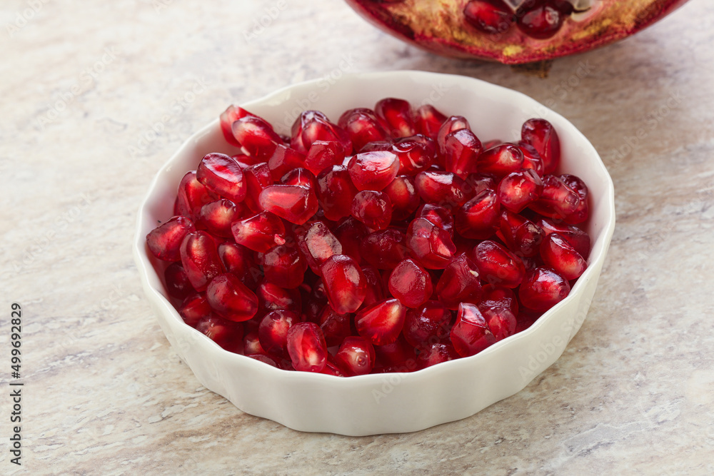 Ripe red Pomegranate seeds in the bowl Ripe red Pomegranate seeds in the bowl
