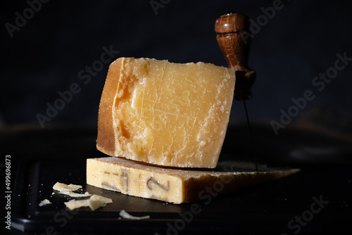 Parmesan cheese on wooden board photo