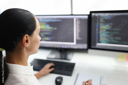 Woman broker is working on computer in field of stock exchange investment